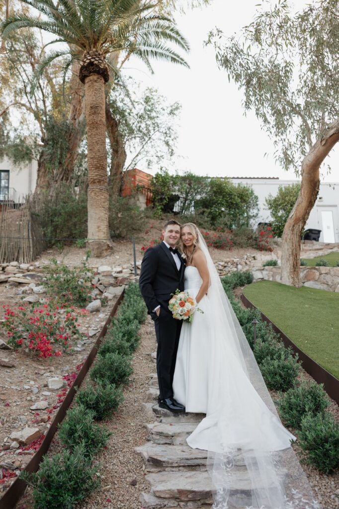 Bride and groom portrait on the garden path at Wrigley Mansion in Phoenix Arizona